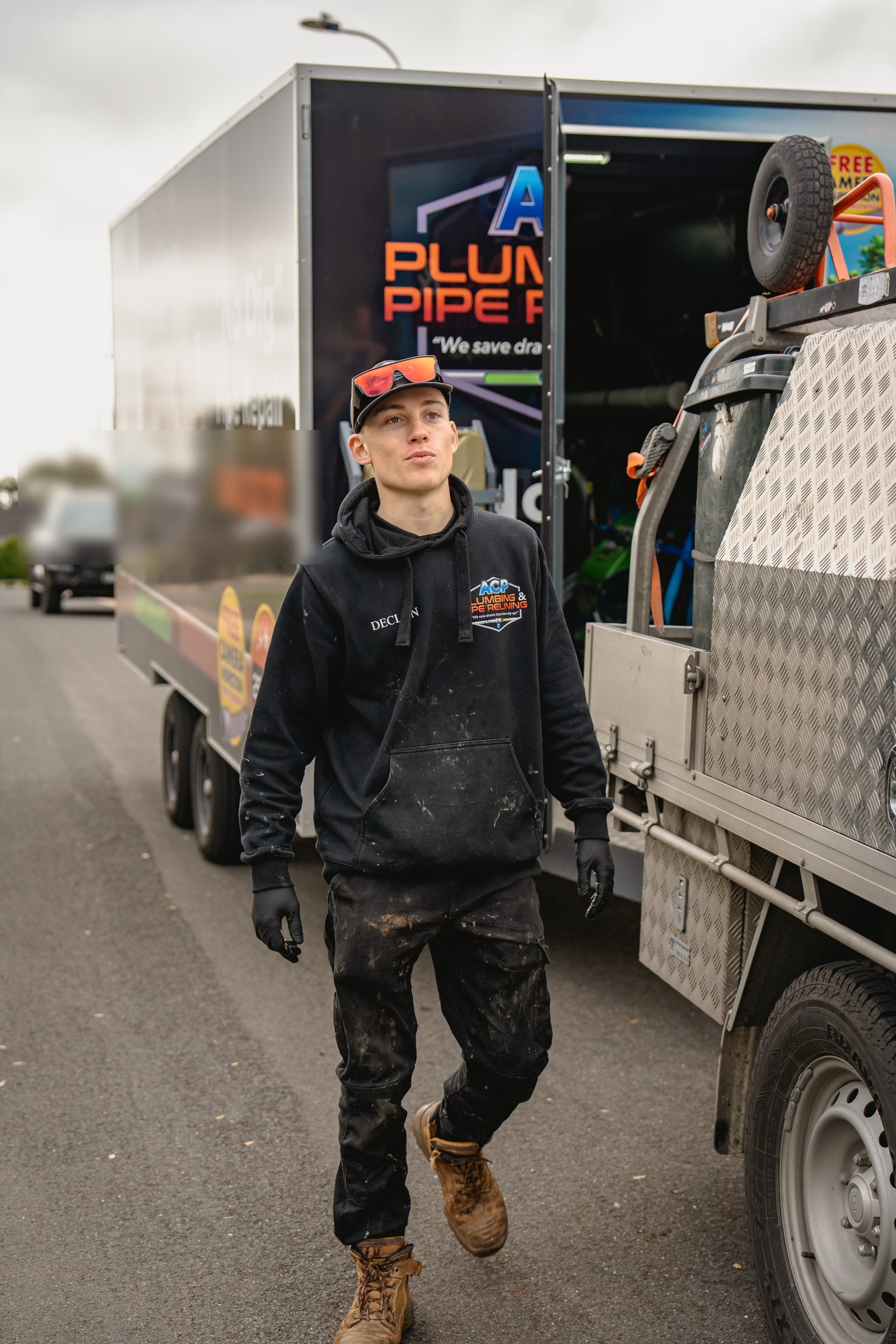 ACP plumber beside the truck